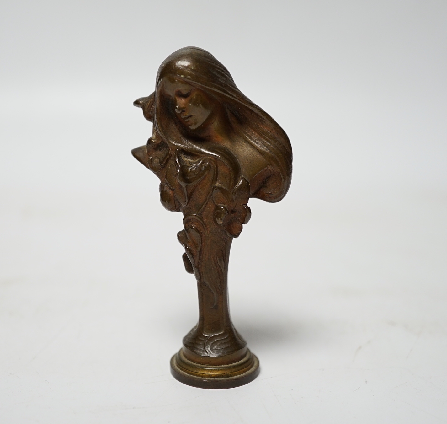 A small Art Nouveau figural bronze desk seal, 8.5cm high